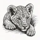 lion cub laying horizontally tattoo design idea