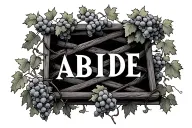 the text: ABIDE surrounded by a box made of grape vines and trellis tattoo design idea