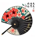 makes a traditional fan with coreen weather, hibiscus flowers and a Korean knot Maedup tattoo design idea