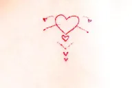 Red, small cursive tattoo, John F on top heart in the middle Vanessa S at the bottom and hearts around tattoo design idea