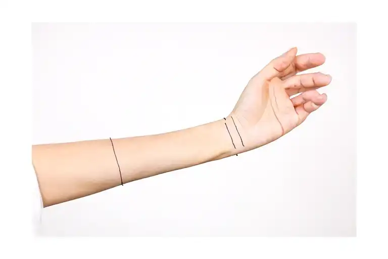 left arm cuff drawn with a single tattoo design idea