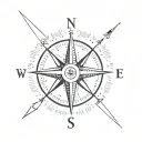 simple compass cross with arrow pointing North with small lotus flower in bottom right hand corner tattoo design idea