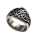 celtic knot ring with a celtic style arrow in the cender of the ring. tattoo design idea