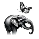 an elephant reaching out for a butterfly  tattoo design idea