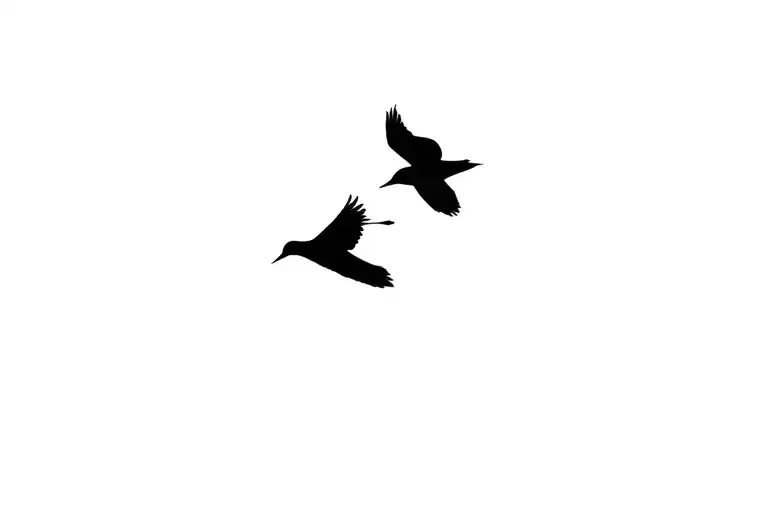 two small birds flying away tattoo design idea