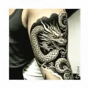 dragon wrapped around a battle worn samurai on the upper arm and foo dog on the lower arm tattoo design idea