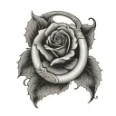 black-and-gray design featuring a horseshoe with a rose in the center. The horseshoe is positioned in a "U" shape, symbo tattoo design idea