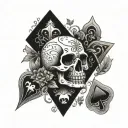 small skull with 7 of spades 2 of diamonds playing card tattoo design idea