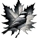maple leaf wrapped around a mockingbird dainty tattoo design idea