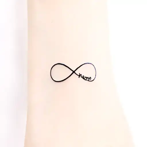 infinity symbol whit name written inside tattoo design idea