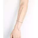 Minimalist forearm cuff tattoo design idea