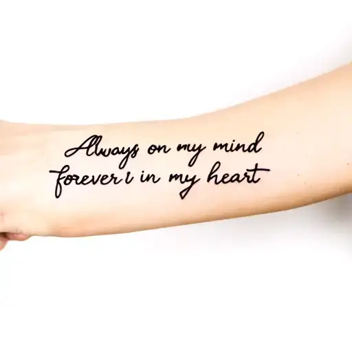writing on the inside of arm where the crease is infront of the elbow saying always on my mind forever in my heart in  tattoo design idea