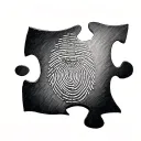 Fingerprint in a puzzle piece tattoo design idea