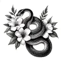 python snake intertwined in edgy flowers for collarbones  tattoo design idea