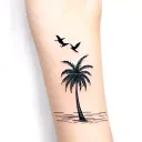 a palm tree with birds tattoo design idea
