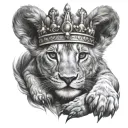 A lion cub with a prayer crown on its belly. tattoo design idea