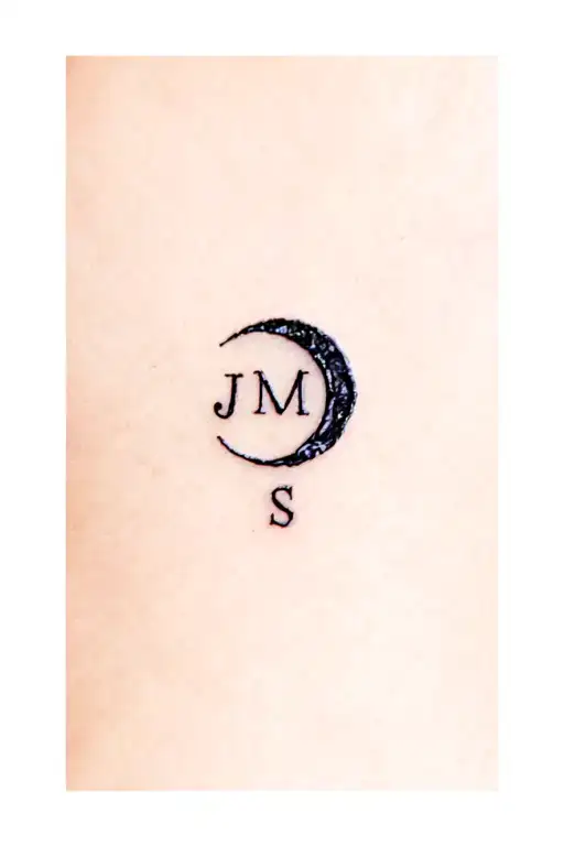 small eclipse with hidden letters J,M,S tattoo design idea