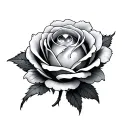 a large round gemstone sitting in the center of a rosebud tattoo design idea