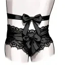 garter lace wrapped around thigh with bow tie tattoo design idea