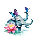 Elephant head with trunk up with butterfly at top of trunk surrounded with lotus flowers tattoo design idea