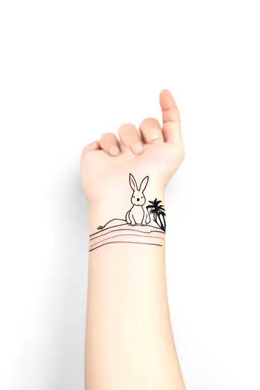thin straight horizon line on arm. Cute psychedelic rabbit sitting on the line with a palmtree tattoo design idea