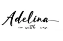 "Adelina in cursive with a rose" tattoo design idea