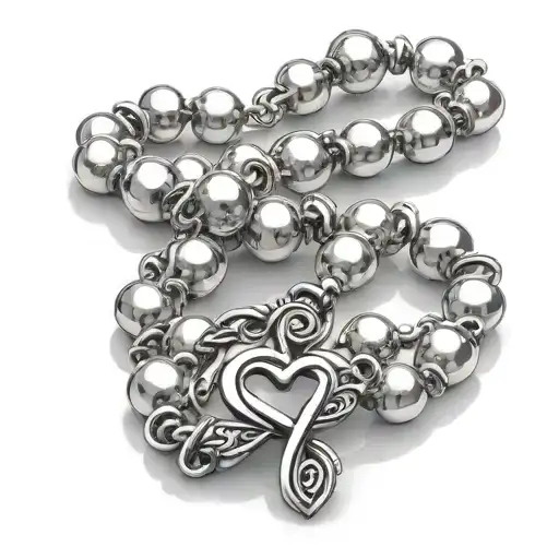 Rosary of fine pearls on the wrist with infinity heart sign clasp tattoo design idea
