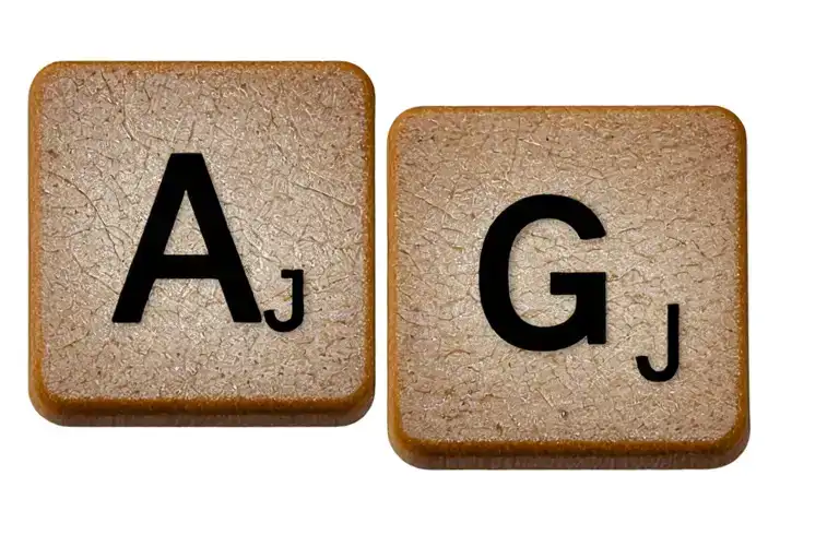 three scrabble letter tiles A G J tattoo design idea