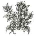 Anatomically correct spine with dainty flowers coming out of it on the spine tattoo design idea